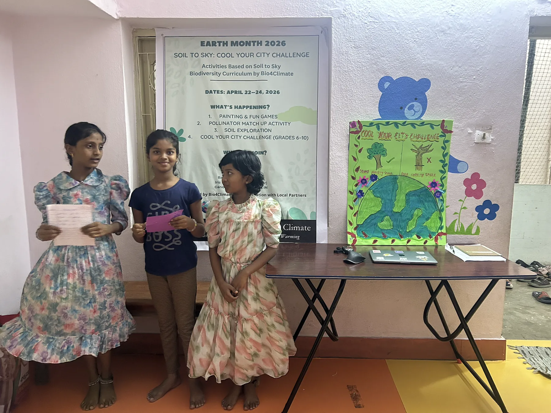 Team one prepares to present a Cool Your City Challenge project about planting trees and stopping tree cutting.