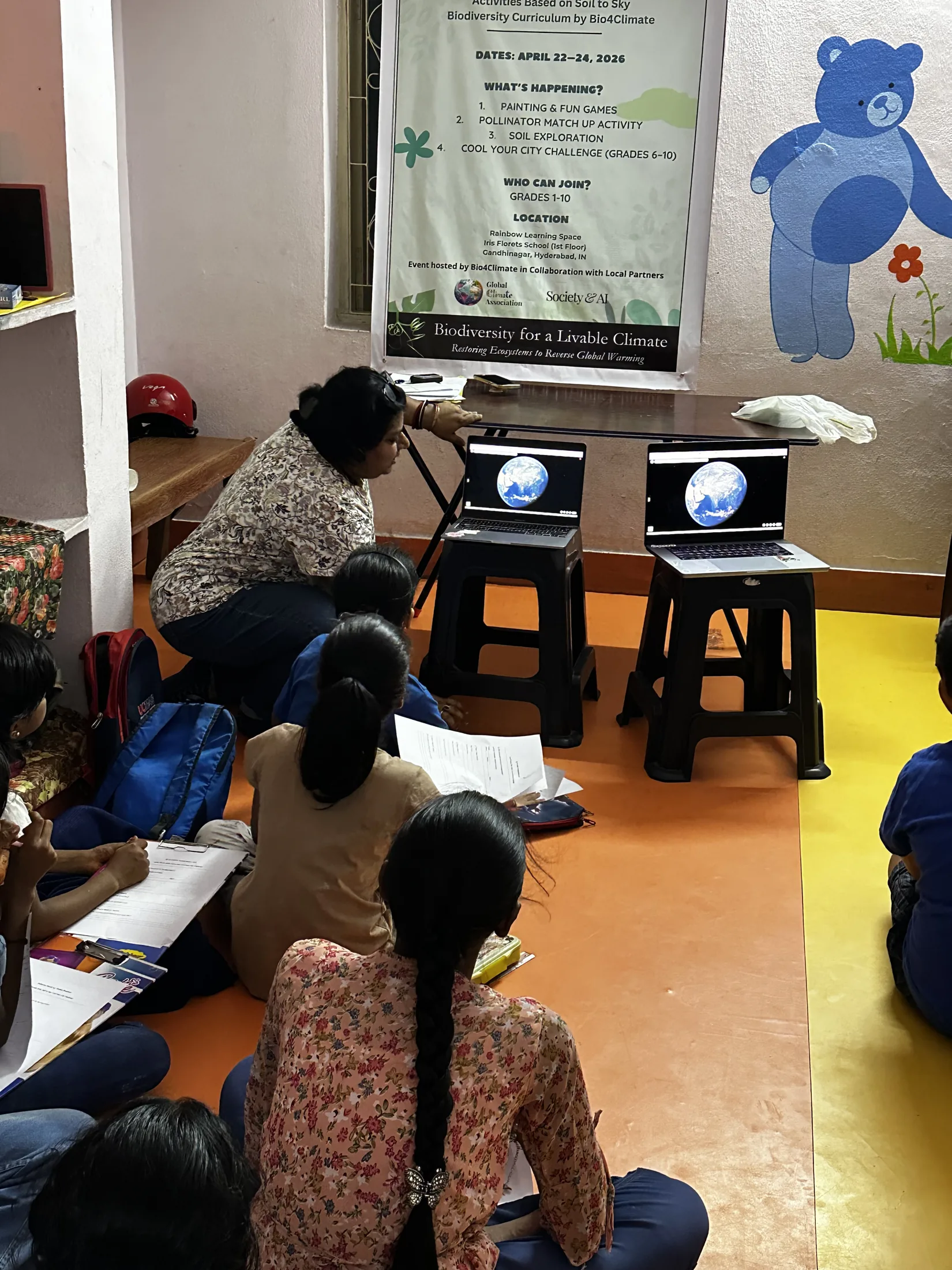Poulomi Chakravarty introduces live global maps to the children at the start of day two.
