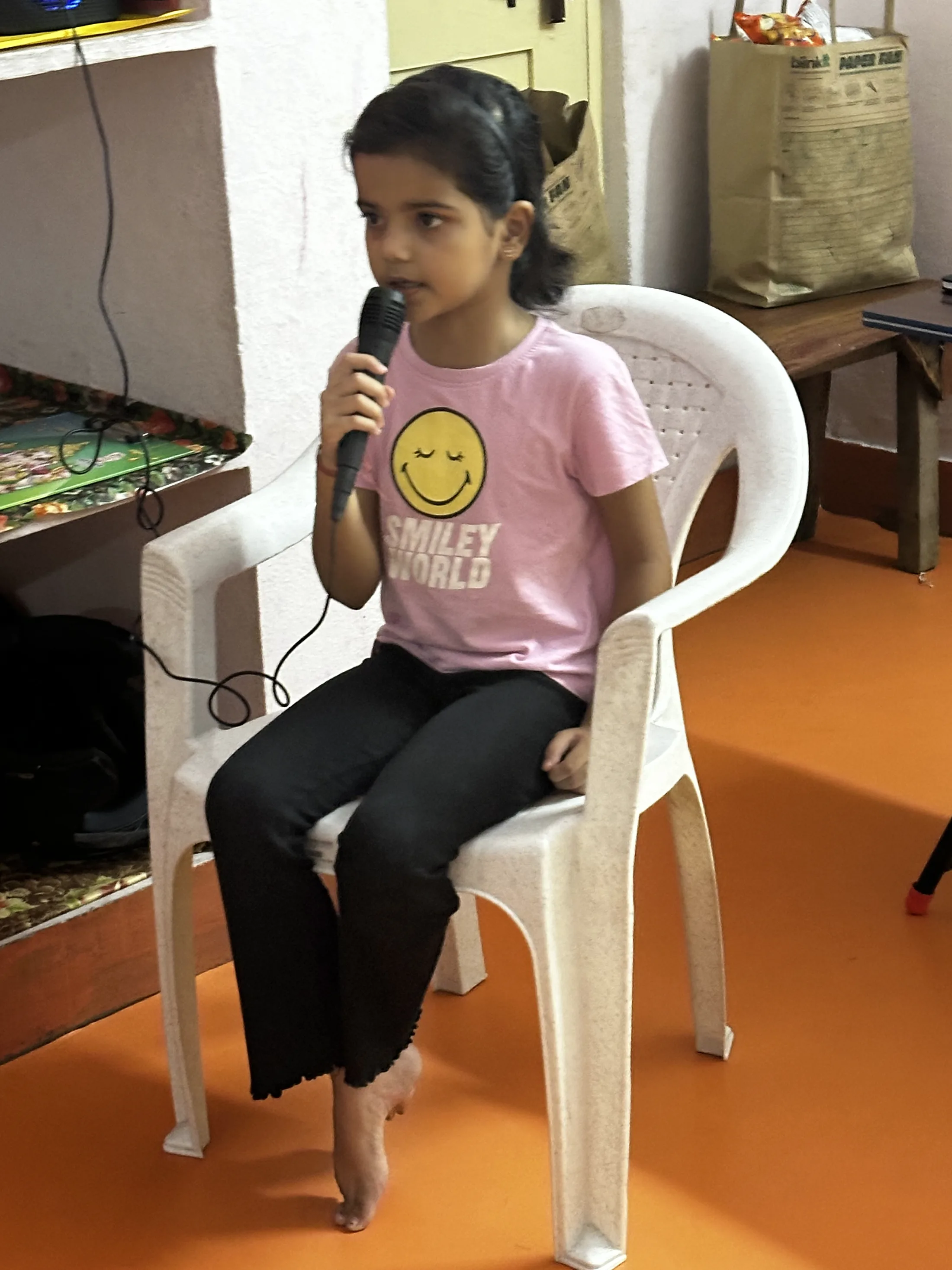 A second young participant speaks during the opening welcome.