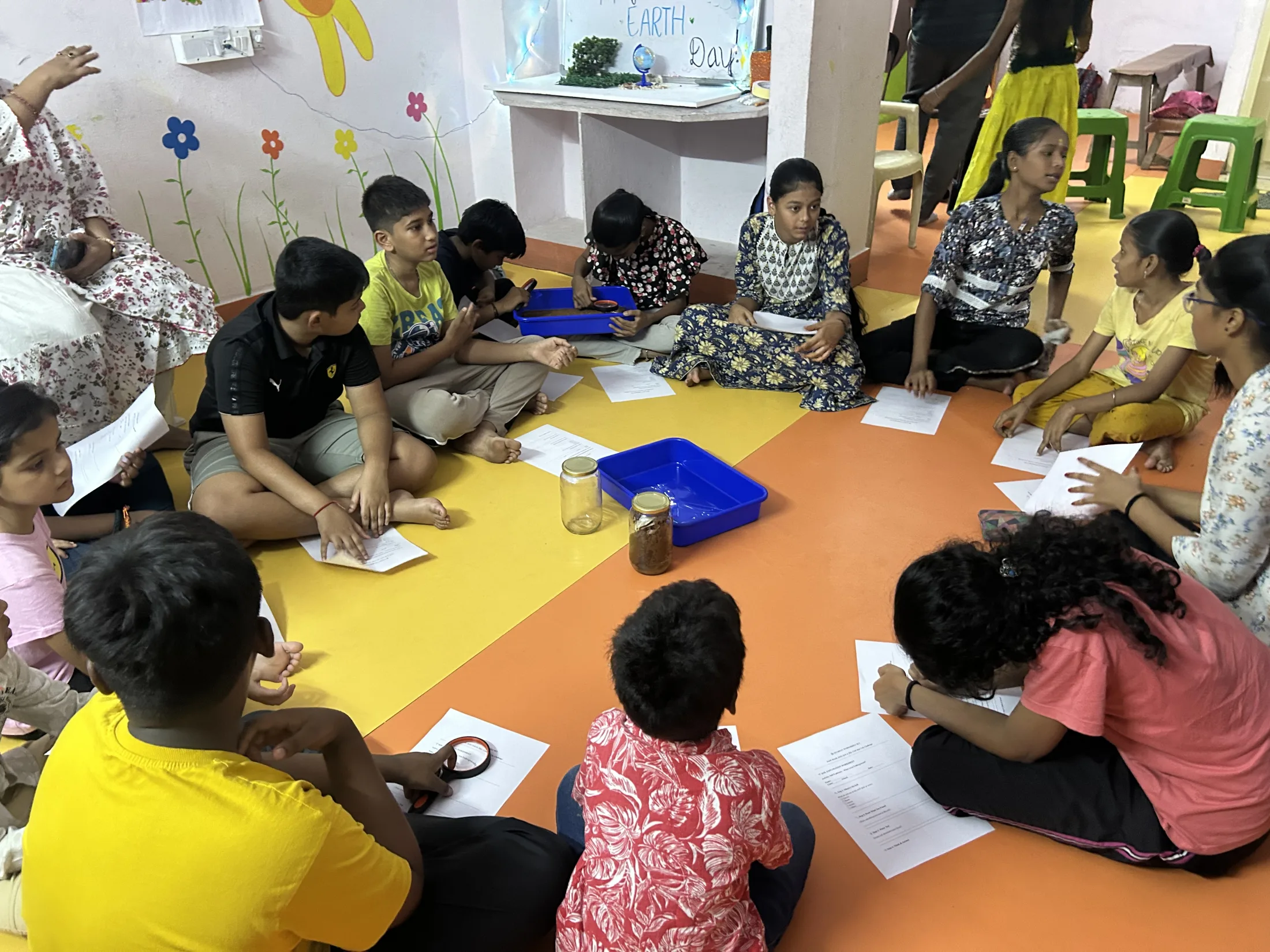 Children continue the hands-on soil exploration activity during the Hyderabad session.